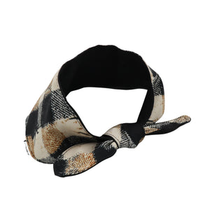 A fabric headband with a black and beige plaid pattern and a tie knot, shown on a plain white background.
