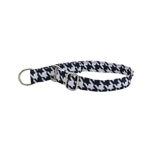 Black and white houndstooth patterned dog collar on a light gray background