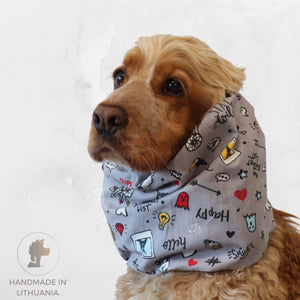 Cocker Spaniel wearing cotton summer dog snood with colorful doodles, perfect for protecting long ears in warm weather