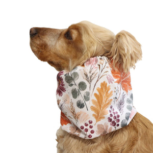 Side view of a Cocker Spaniel wearing the Autumn Garden waterproof snood, showing how the fabric covers and protects the dog's long ears.
