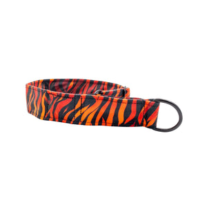 Dog collar with orange and black zebra pattern on a white background