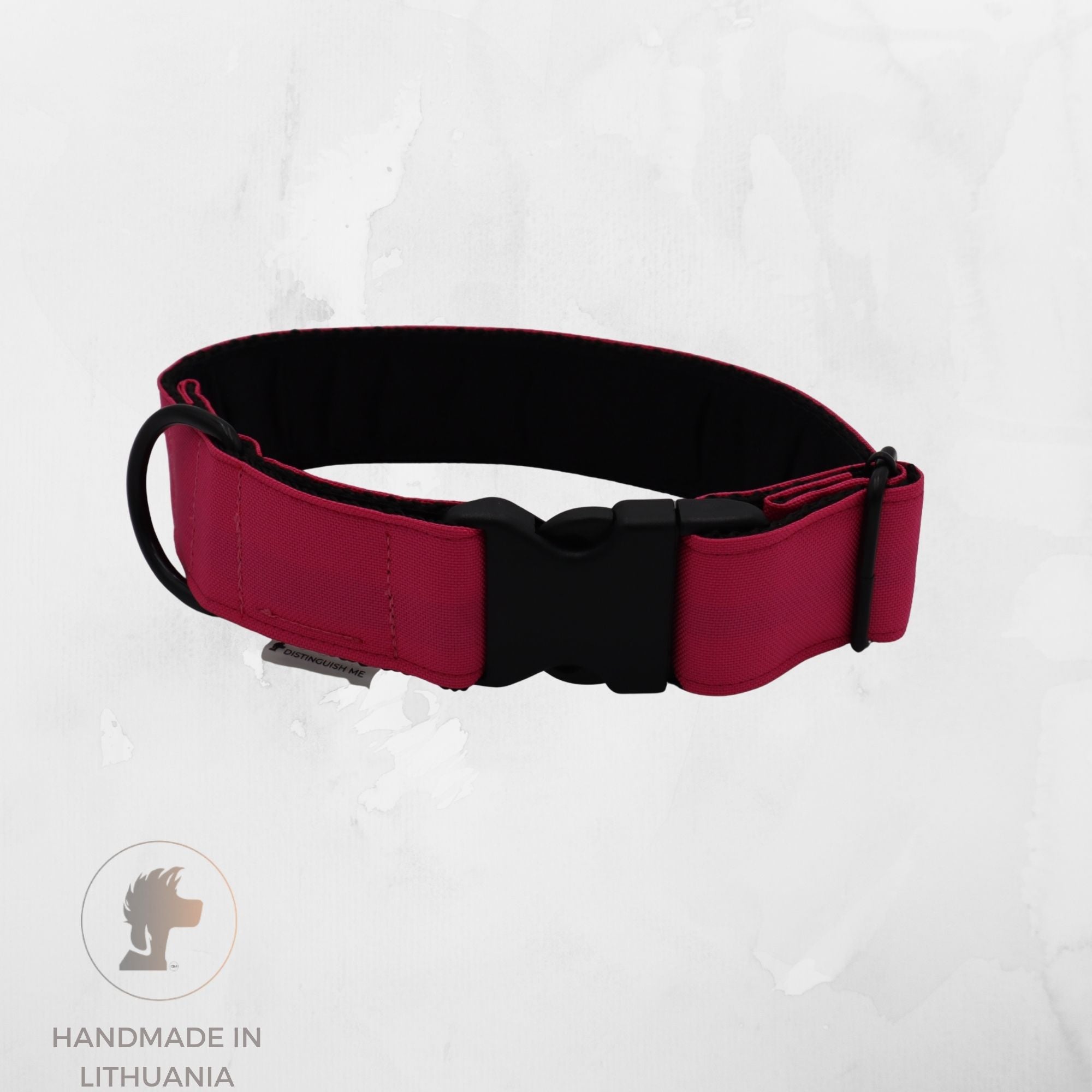 A red and black dog collar with a black plastic buckle, displayed on a light gray textured background with a 'Handmade in Lithuania' logo in the bottom-left corner.
