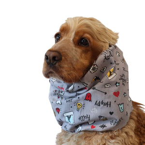 Cocker Spaniel wearing cotton summer dog snood with colorful doodles, perfect for protecting long ears in warm weather