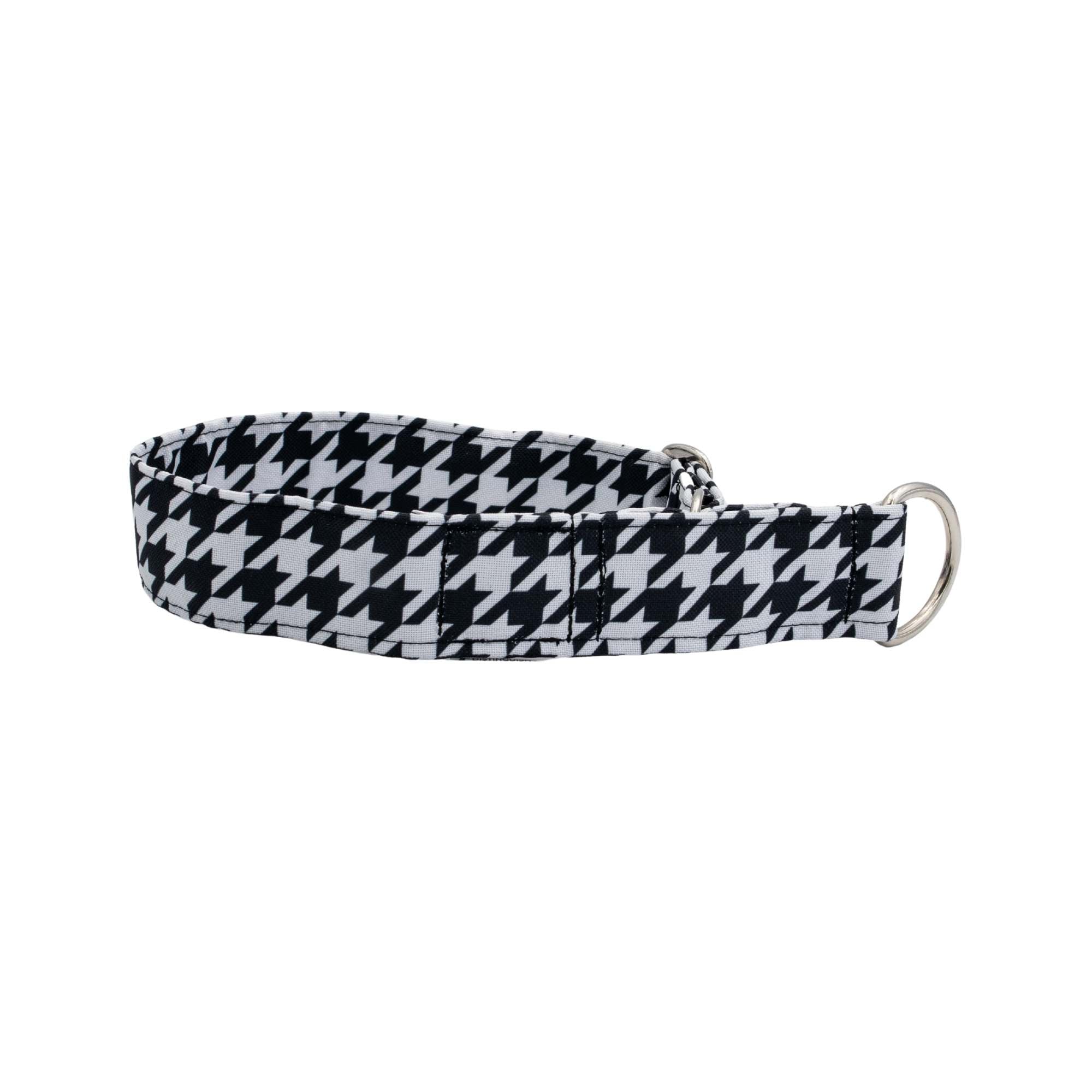 Black and white houndstooth patterned dog collar on a light gray background