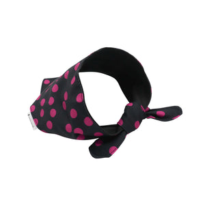 A black pet bandana with bright pink polka dots, tied in a bow at the front, shown on a plain white background.