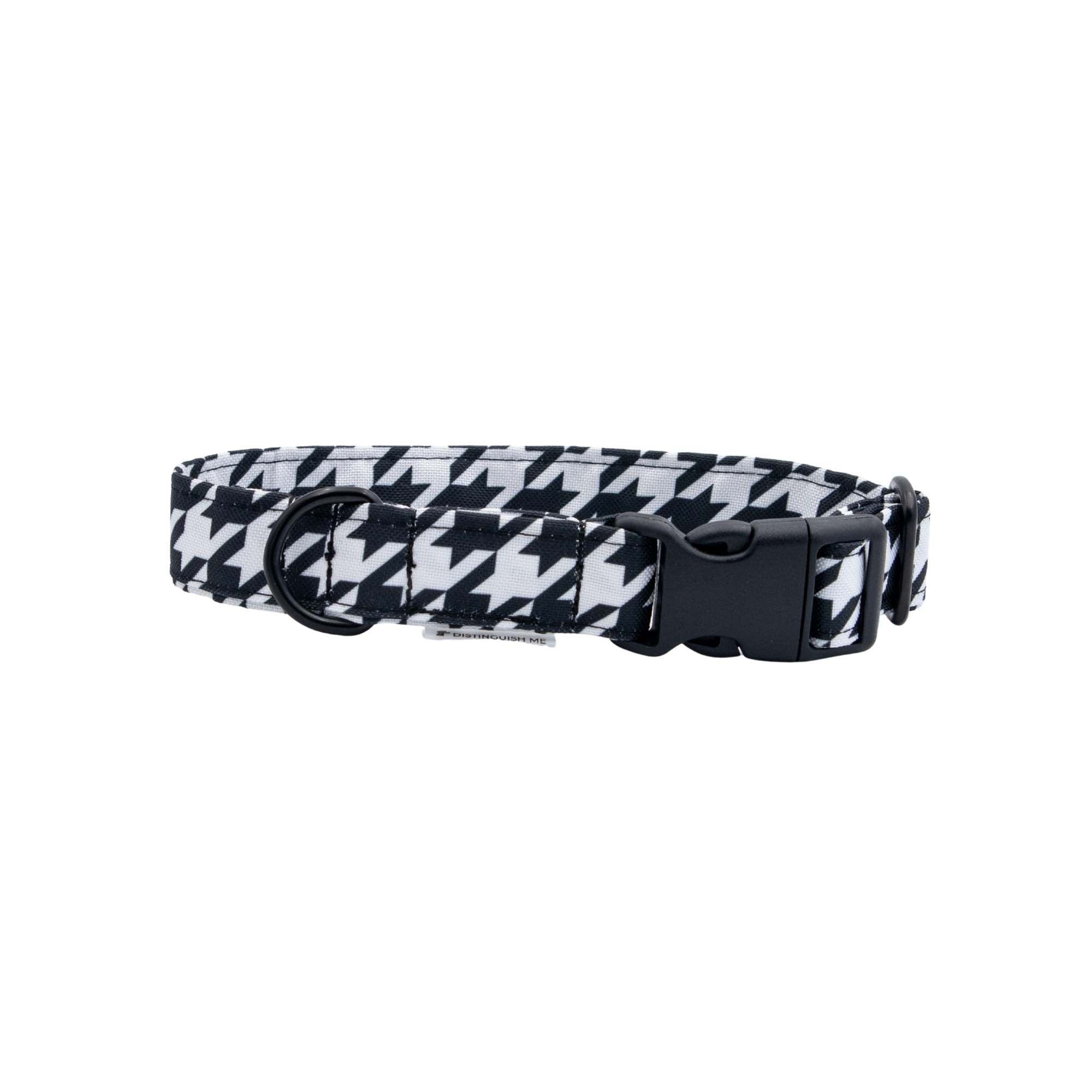 Black and white houndstooth patterned dog collar on a light gray background